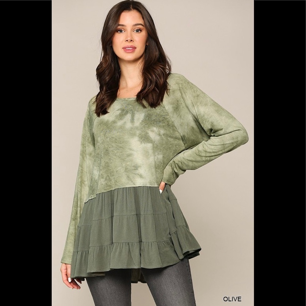Tie dye knit and solid woven mixed top with ruffle hem.